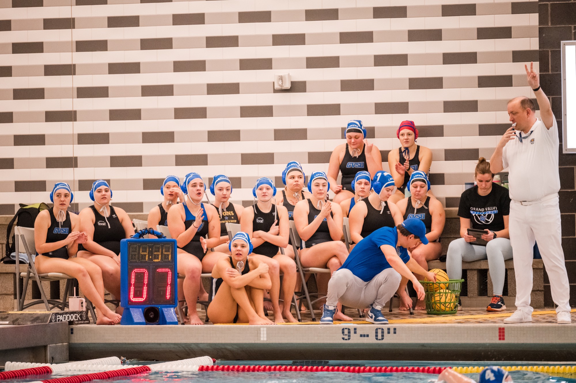 The bench intently watching during a game